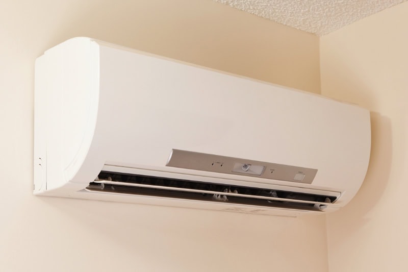 Hot and Cold Spots? Get Even Heating and Cooling in Your Missoula Home. A wall-mount mini-split heating and air conditioning unit installed in a new house.